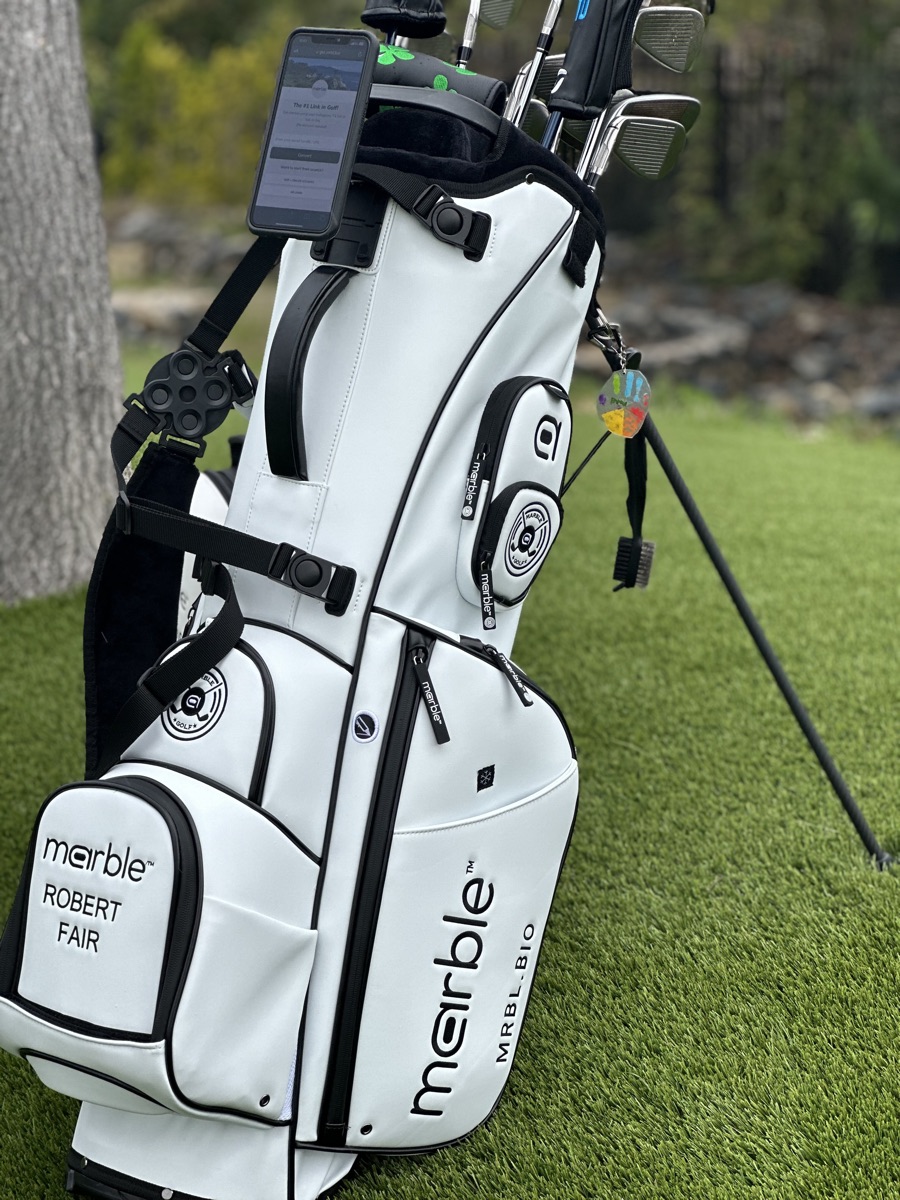 The bag's white side panel monogrammed with a golfer's name